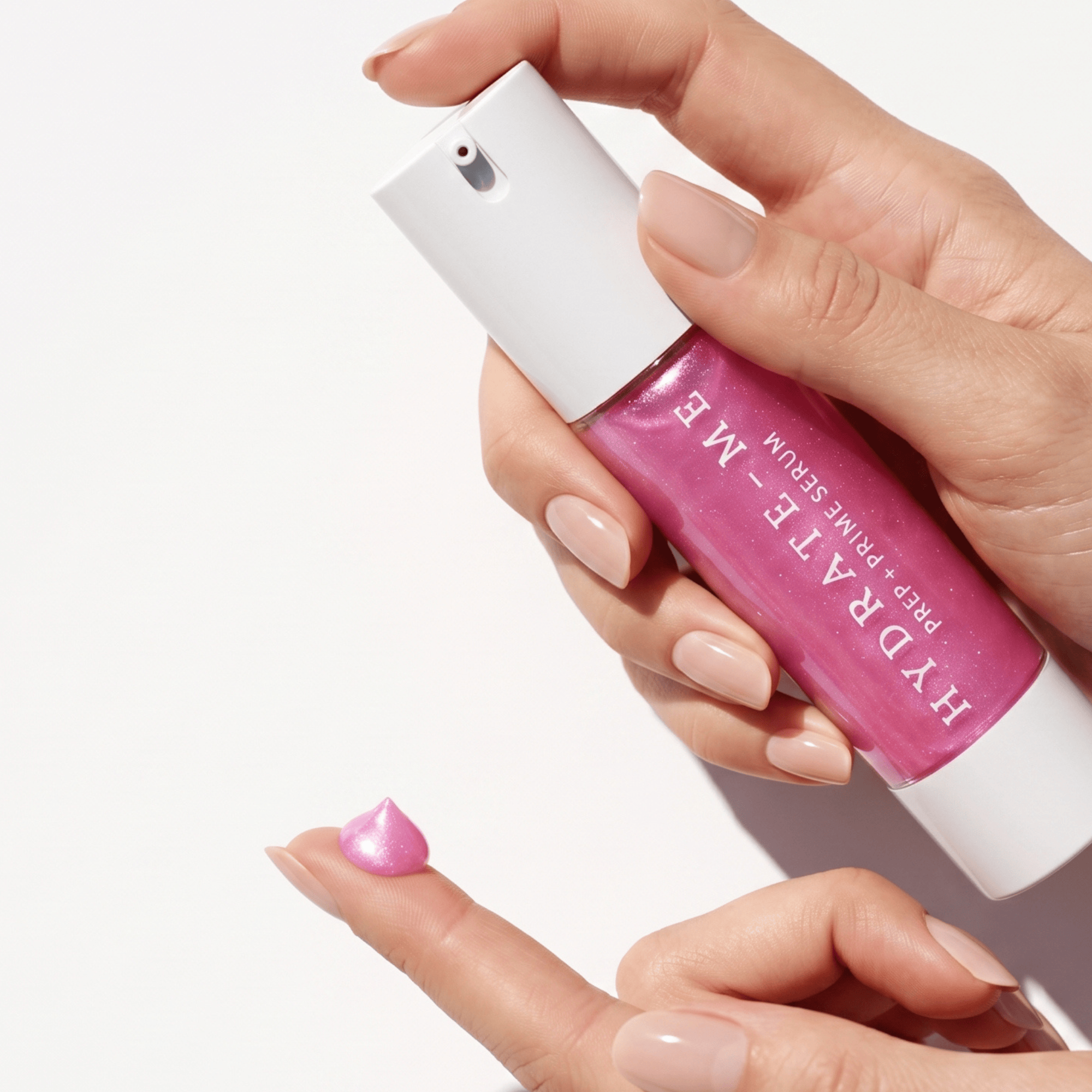 Hand holding Klasyk Beauty HYDRATE-ME prep and prime face serum bottle